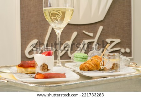 aperitif with white wine and sweets and salt stuff