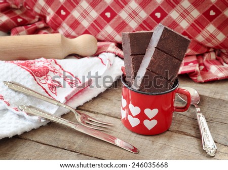 Modica chocolate bars inside hearts decorated mug with vintage silverware