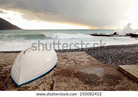boat hull over stormy seascape with perfect focus over the boat hull