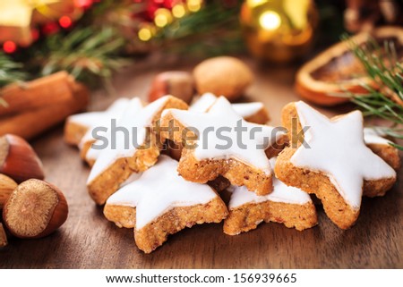 fresh cinnamon star shaped cookies with frosting