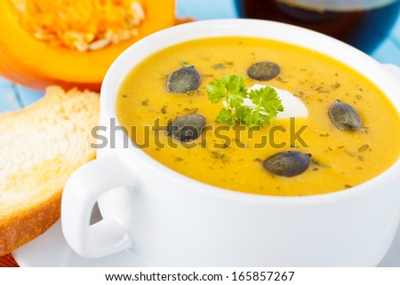 fresh homemade pumpkin soup with bread