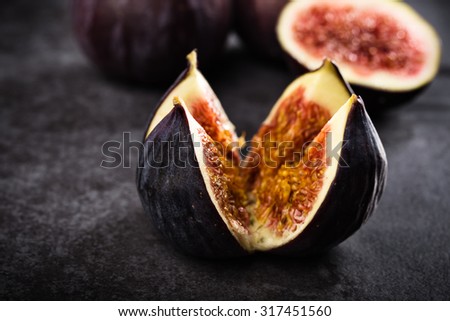 Still life of a fresh fig on dark background