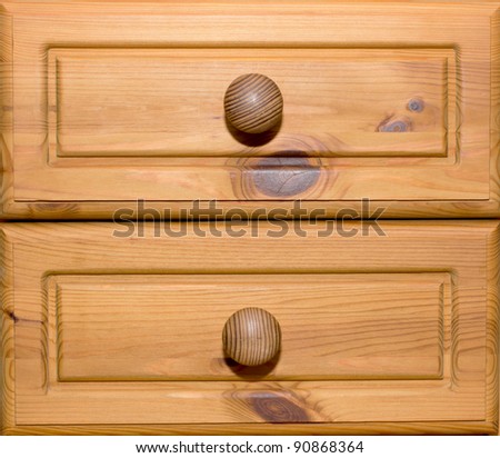 Two wooden drawers with knobs