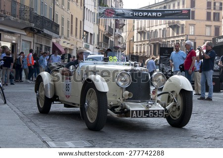 BRESCIA,ITALY - MAY,13:Registration of participants of the famous race retro cars Mille Miglia, May 13,2015 in Brescia,Italy. Driver Damian Pozzoli on ASTON MARTIN Le Mans, 1933 built