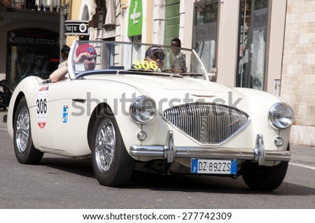 BRESCIA,ITALY - MAY,13:Registration of participants of the famous race retro cars Mille Miglia, May 13,2015 in Brescia,Italy. Driver Vincenzo Bricchetti on AUSTIN HEALEY 100/4, 1954 built
