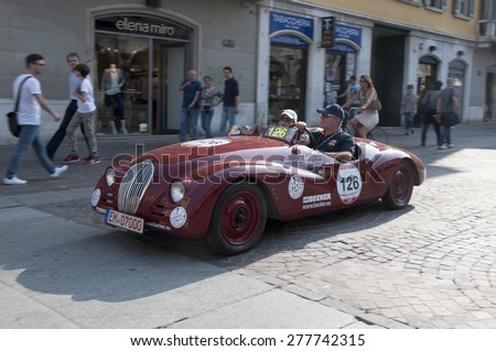 BRESCIA,ITALY - MAY,13:Registration of participants of the famous race retro cars Mille Miglia, May 13,2015 in Brescia,Italy. Driver Harald Becker on FIAT 508 C Sport, 1937 built
