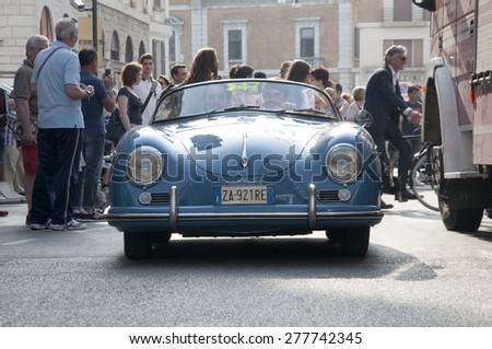 BRESCIA,ITALY - MAY,13:Registration of participants of the famous race retro cars Mille Miglia, May 13,2015 in Brescia,Italy. Driver Andrea Rugger on PORSCHE 356 1500 Speedster, 1955 built
