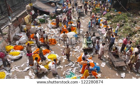 KOLKATA, INDIA - NOVEMBER 10: Unidentified people buying and selling flowers at the flower market in Kolkata on November 10, 2009.
