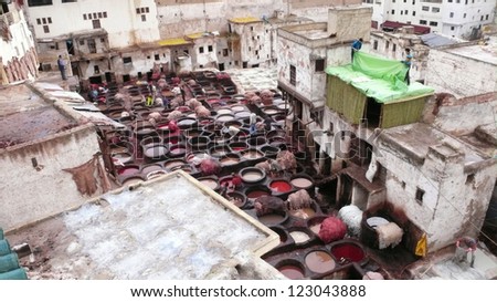 FEZ, MOROCCO - FEBRUARY 19: Unidentified men preparing to treat animal hides that will be dyed in this traditional Moroccan leather tannery on February 19, 2008 in Fez.
