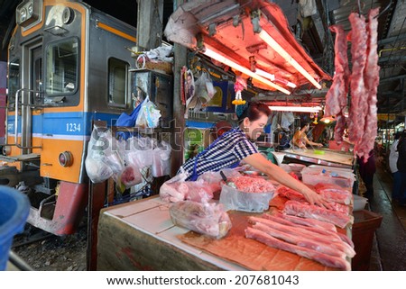SAMUT SAKHON, THAILAND - MARCH 31: Unidentified people selling meat in the market on March 31, 2014 in Samut Sakhon, Thailand