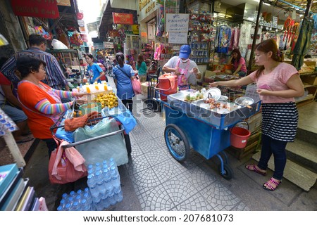 BANGKOK, THAILAND - APRIL 1: Unidentified people selling food in the market Talat Mai on April 1, 2014 in Bangkok, Thailand