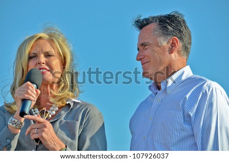HOLLAND, MICHIGAN - JUNE 19: Mitt and Ann Romney during a campaign rally at Holland State Park on June 19, 2012 in Holland, Michigan.