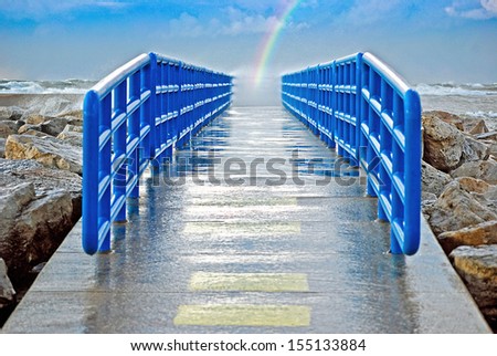 rainbow at the end of a pier in Holland, Michigan