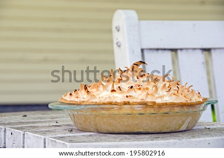 coconut cream pie on an outdoor patio table