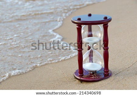wooden sand timer at the seashore