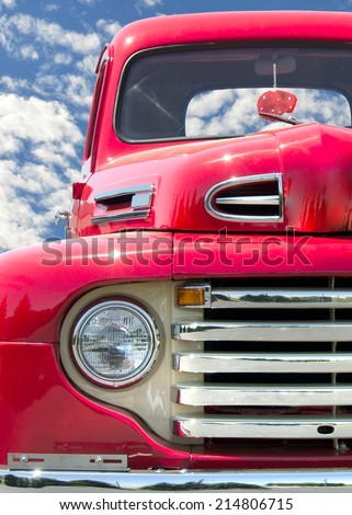 retro red truck with red fuzzy dice