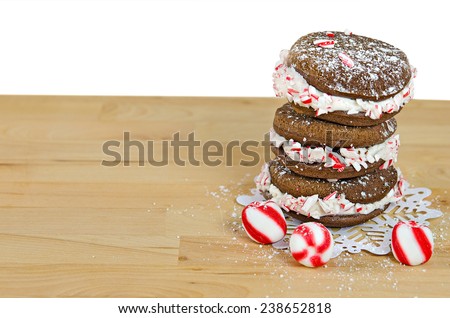 chocolate whoopie pie with crushed candy cane on snow flake lace doily