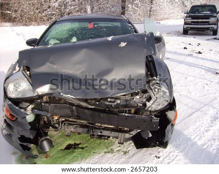 car crash on icy road with leaking antifreeze