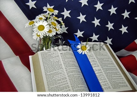 bible and daisies on flag