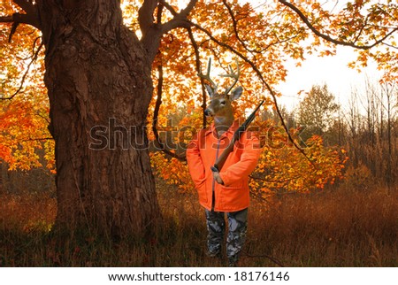deer hunter in autumn woods