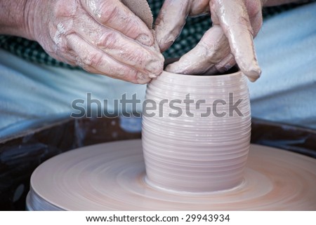 potter creating a vase