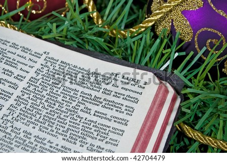open bible with gold rope and ornament