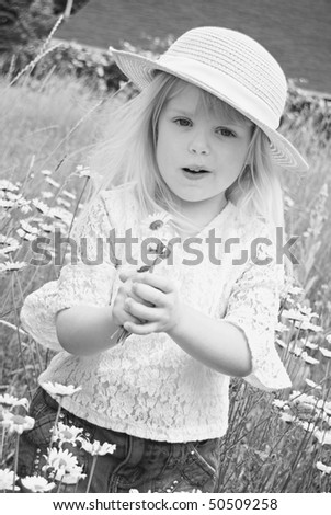 blond girl with daisy bouquet