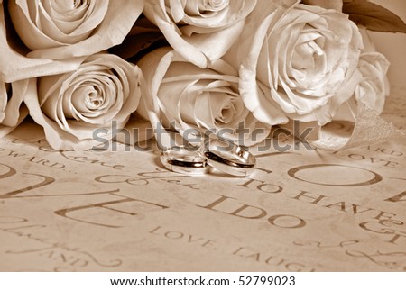 stock photo bridal bouquet with wedding rings in sepia