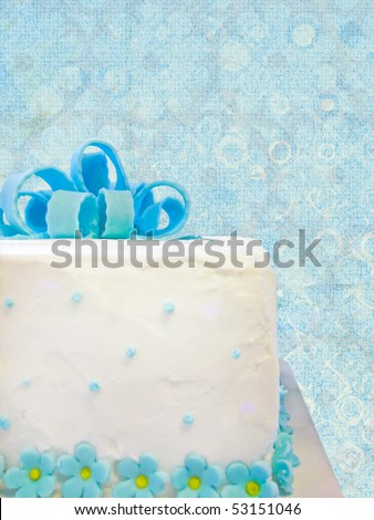 fancy birthday cake on textured background