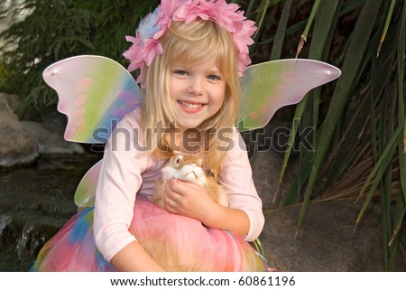 little girl with fairy wings and bunny