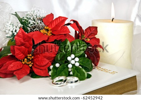 stock photo christmas wedding bouquet and rings on bible