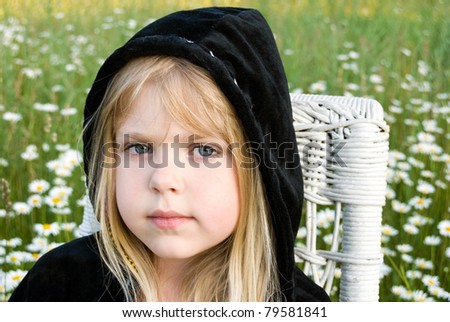 http://image.shutterstock.com/display_pic_with_logo/87499/87499,1308537411,3/stock-photo-little-blond-girl-wearing-a-black-hoodie-79581841.jpg