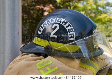 firefighter\'s helmet on coat