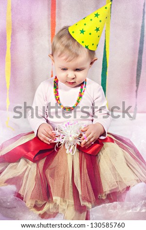Little cute princess in birthday cap