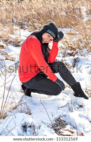 Young beautiful woman outdoors in winter