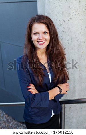 Half-length portrait of young beautiful business woman