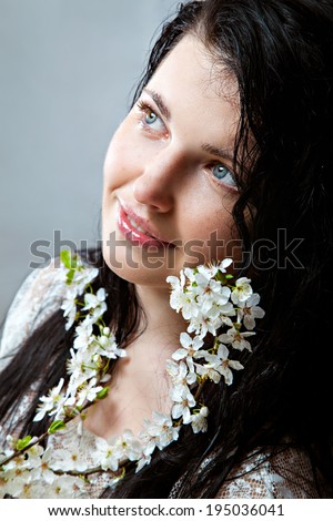 Natural beauty with spring blossom - young woman without make-up