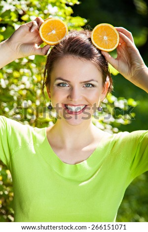 Young woman with with orange, healthy food concept, skin care and beauty, vitamins and minerals