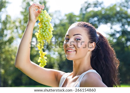 Young woman with with grapes, healthy food concept, skin care and beauty, vitamins and minerals