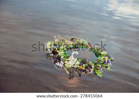 Wreath floating on water, tradition Kupala night pagan rituals