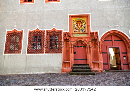 Two Renaissance doorways painted bright coral with Gothic ornament, Meissen, Germany