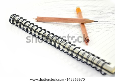 Notebook paper with broken pencil
