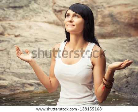 Athletic Caucasian Woman Praying Alone in Nature