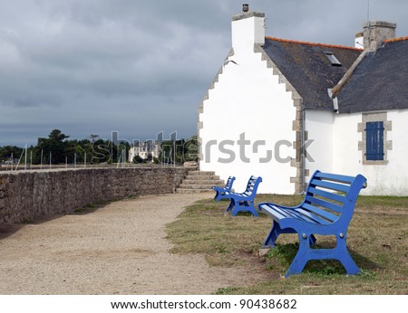 Blue benches and a white house, Brittany, France