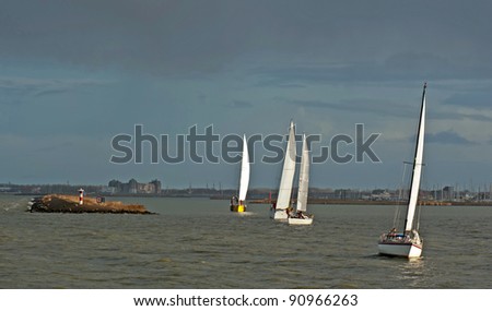 Sailing boats sailing on a lake in fall, Netherlands