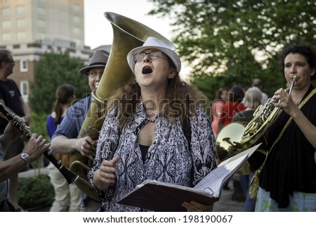 MADISON, WISCONSIN USA - JUNE 6: An impromptu group played music for the newlywed gay and lesbian couples  after a judge struck down Wisconsin\'s gay marriage ban on Friday June 6, 2014 in Madison, WI