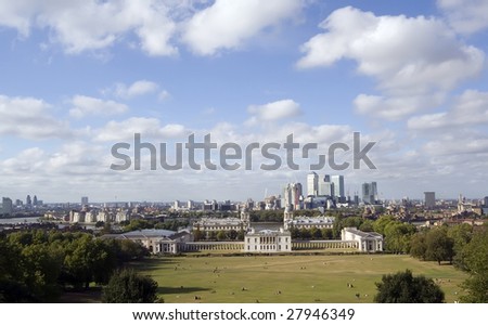 The National Maritime Museum (former Royal Naval College) and the Queen\'s House at Greenwich, with Canary Wharf and the East End across the River Thames.