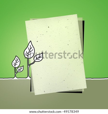 recycled paper on green background with leaves