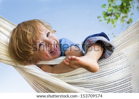 Laughing Child In Hammock