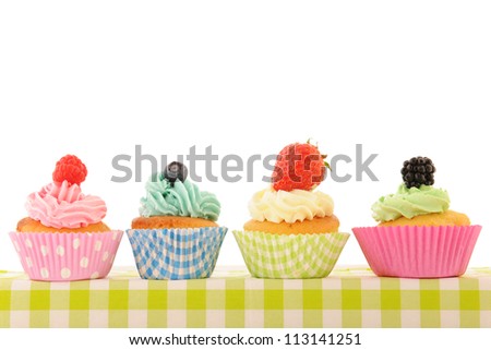 assortment fruit cupcakes isolated over white background